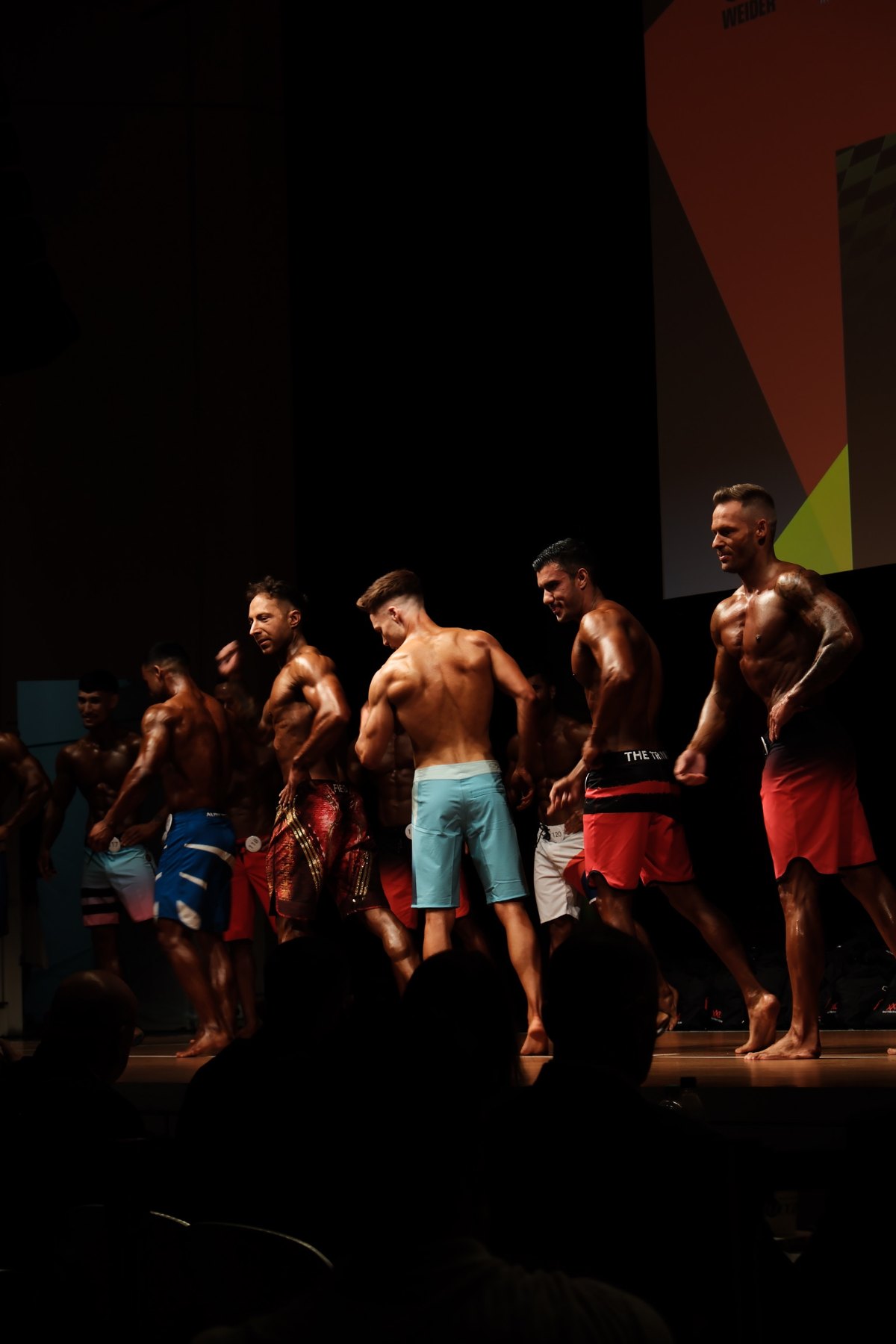 Melih Korkut auf der Wettkampfbühne, Men’s Physique